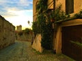 Splendid ancient street in Saluzzo town, Piedmont region, Italy. History, sunset, enchanting architecture and art