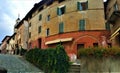 Splendid ancient street in Saluzzo town, Piedmont region, Italy. Colours, history, enchanting architecture and art