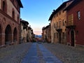 Splendid ancient street in Saluzzo town, Piedmont region, Italy. History, sunset, enchanting architecture and art