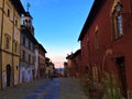 Splendid ancient street in Saluzzo town, Piedmont region, Italy. History, sunset, enchanting architecture and art