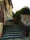Splendid ancient street and stairway in Saluzzo town, Piedmont region, Italy. History, enchanting architecture and art