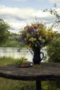 Splendid bouquet of wild flowers on landscape background Royalty Free Stock Photo
