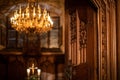 Splendid chandelier with lit candles in a beautiful room Royalty Free Stock Photo