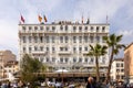 Splendid Hotel in Cannes with boules player on the forecourt, France Royalty Free Stock Photo