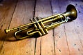 A splendid Jazz trumpet from the 1930s, on a wooden table from the 1920s Royalty Free Stock Photo