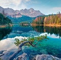 Splendid morning scene of Eibsee lake with Zugspitze mountain range on background. Colorful autumn view of Bavarian Alps, Germany,