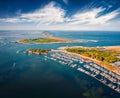 Splendid morning view from flying drone of Sottomarina port and San Felice fortress, Italy, Europe.