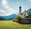 Splendid morning view of San Giovanni Church in St. Magdalena village. Sunny summer scene of Funes Valley Villnob with Odle Royalty Free Stock Photo