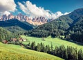 Splendid morning view of St. Magdalena village. Sunny summer scene of Funes Valley Villnob with Odle Group mountains on Royalty Free Stock Photo