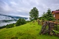 Splendid mountain valley is covered with fog after the rain. Hut in the mountains. Location place Carpathian mountains, Ukraine, Royalty Free Stock Photo