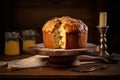 a splendid Pannetone cake showcased on a stand, accompanied by artfully plated slices. Royalty Free Stock Photo