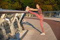 Glorious ginger fitness woman doing stretching workout