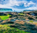 Splendid summer morning in Dyrholaey Nature Reserve. Great outdoor view of Reynisdrangar cliffs in the Atlantic ocean, south coas Royalty Free Stock Photo