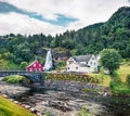 Splendid summer scene of waterfall Steinsdalsfossen on the Fosselva River. Picturesque evenig scene of village of Steine, municip Royalty Free Stock Photo