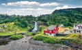 Splendid summer scene of waterfall Steinsdalsfossen on the Fosselva River. Picturesque evenig scene of  village of Steine, Royalty Free Stock Photo