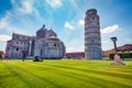 Splendid summer view of famous Leaning Tower in Pisa. Colorful morning scene with hundreds of tourists in Piazza dei Miracoli Squ Royalty Free Stock Photo