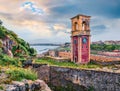 Splendid summer view of Old Venetian Fortress Paleo Enetiko Frourio with Clock Tower. Colorful morning cityscape of Corfu Town,