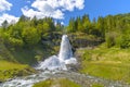 Splendid summer view with popular waterfall Steinsdalsfossen