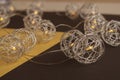 Splendid view of metallic spherical christmas decoration, lights. Beautiful combination of yellow and black backgrounds. Trendy Royalty Free Stock Photo