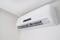 Split air conditioner closeup on white wall in flat indoors Royalty Free Stock Photo