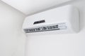 Split air conditioner on a white wall in flat indoors Royalty Free Stock Photo