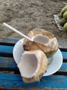 Split coconut in beach afternoon Royalty Free Stock Photo