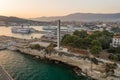 Split, Croatia - Aug 13, 2020: Aerial drone shot of port lighthouse by rock cliff in sunset hour Royalty Free Stock Photo