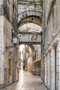 Split, Croatia - Aug 15 2020: Street view of ancient street arch at Diocletian Palace old town