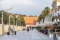 Split, Croatia - Aug 15, 2020: Tourists on esplanade by coean in early morning