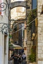 SPLIT, CROATIA, OCTOBER 01, 2017: Tourist walking and taking photo on the narrow street in Split. Royalty Free Stock Photo