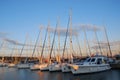 Split, Croatia - October 3, 2010: White sea yachts parked in a harbour on the Adriatic Sea. Sunset at the seaport