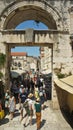 Split, Croatia - 07/22/2015 - People walking through Eastern Silver Gate, part of Diocletian Palace, sunny day, Dalmatia