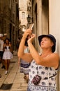 Split, Dalmatia, Croatia; 09/07/2018: A woman takes pictures by phone.