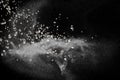 Split debris of stone exploding with white powder against black background Royalty Free Stock Photo