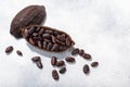 Split fermented cocoa pod with shelled cacao beans atop light grey backdrop, top view, c opy space Royalty Free Stock Photo