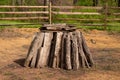 Split logs firewood form a circular stack for a bonfire Royalty Free Stock Photo