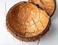 Split Open Coconut Shell with Natural Fibers and Rough Texture on White Surface Royalty Free Stock Photo