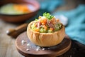 split pea soup in a bread bowl on a rustic cloth