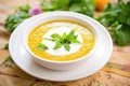 split pea soup garnished with yogurt and mint leaves