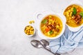 Split pea soup with smoked bacon and crackers in white plate, top view Royalty Free Stock Photo