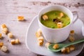Split pea soup in white cup on white board Royalty Free Stock Photo