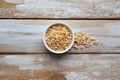 Split peas in white bowl on rustic wooden background