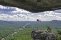 A split rock frames a mountain on Chimney Rock. Royalty Free Stock Photo