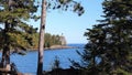 Split Rock Ligthhouse and Lake Superior in Minnesota seen between trees.