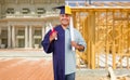 Split Screen Male Hispanic Graduate In Cap and Gown to Engineer in Hard Hat Concept Royalty Free Stock Photo