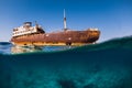 Split shot with wreckship in blue ocean. Arrecife, Lanzarote Royalty Free Stock Photo