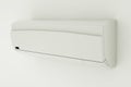 Split-system air conditioner on white wall. 3D illustration Royalty Free Stock Photo