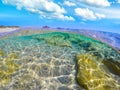 Split underwater view of Costa Rei shore Royalty Free Stock Photo