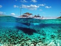 Split view - half underwater view of beautiful seabed with sea fishes and beautiful marine yacht, Turkey, Bodrum Royalty Free Stock Photo