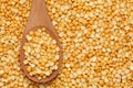 Split yellow peas in a wooden spoon Royalty Free Stock Photo